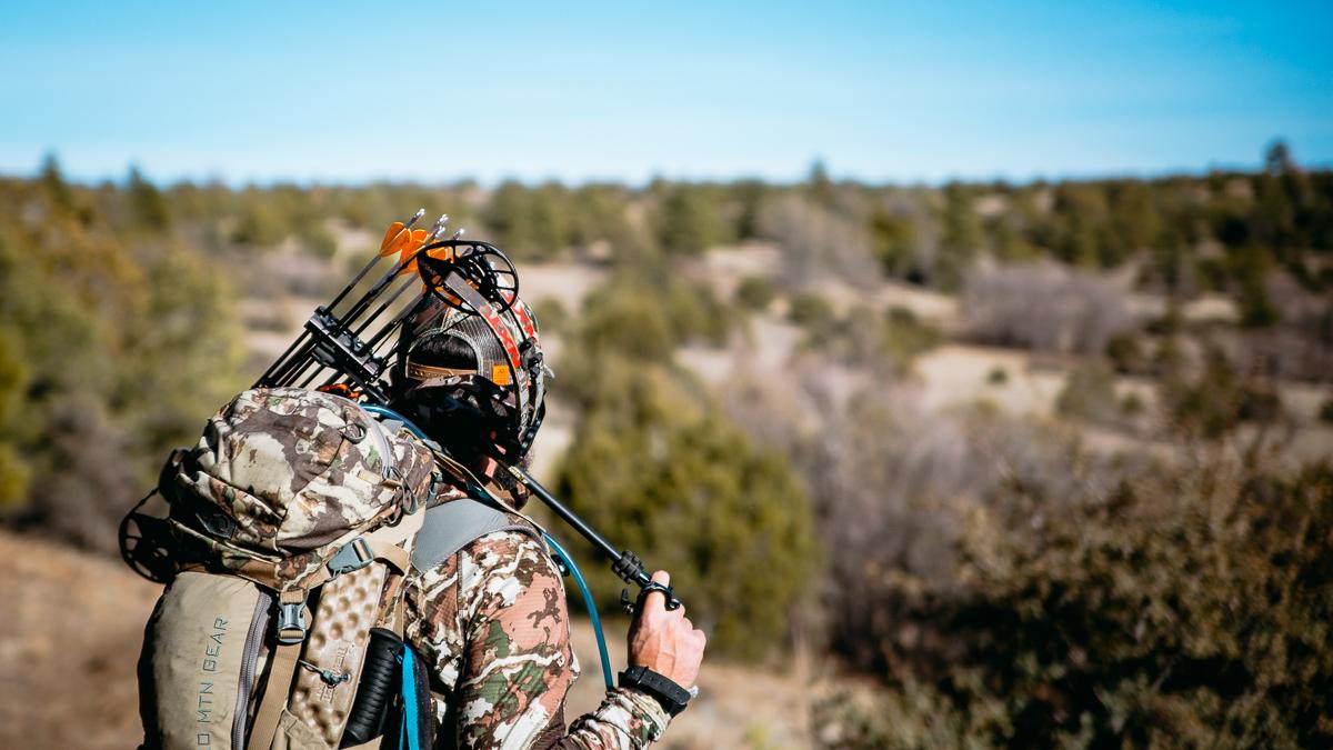 Josh Kirchner from Dialed in Hunter holding his bow and ready for season